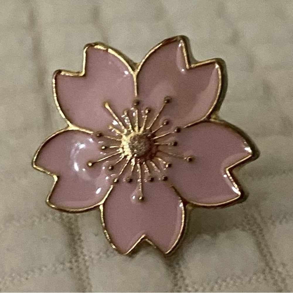 Gold , and pink flower pin .